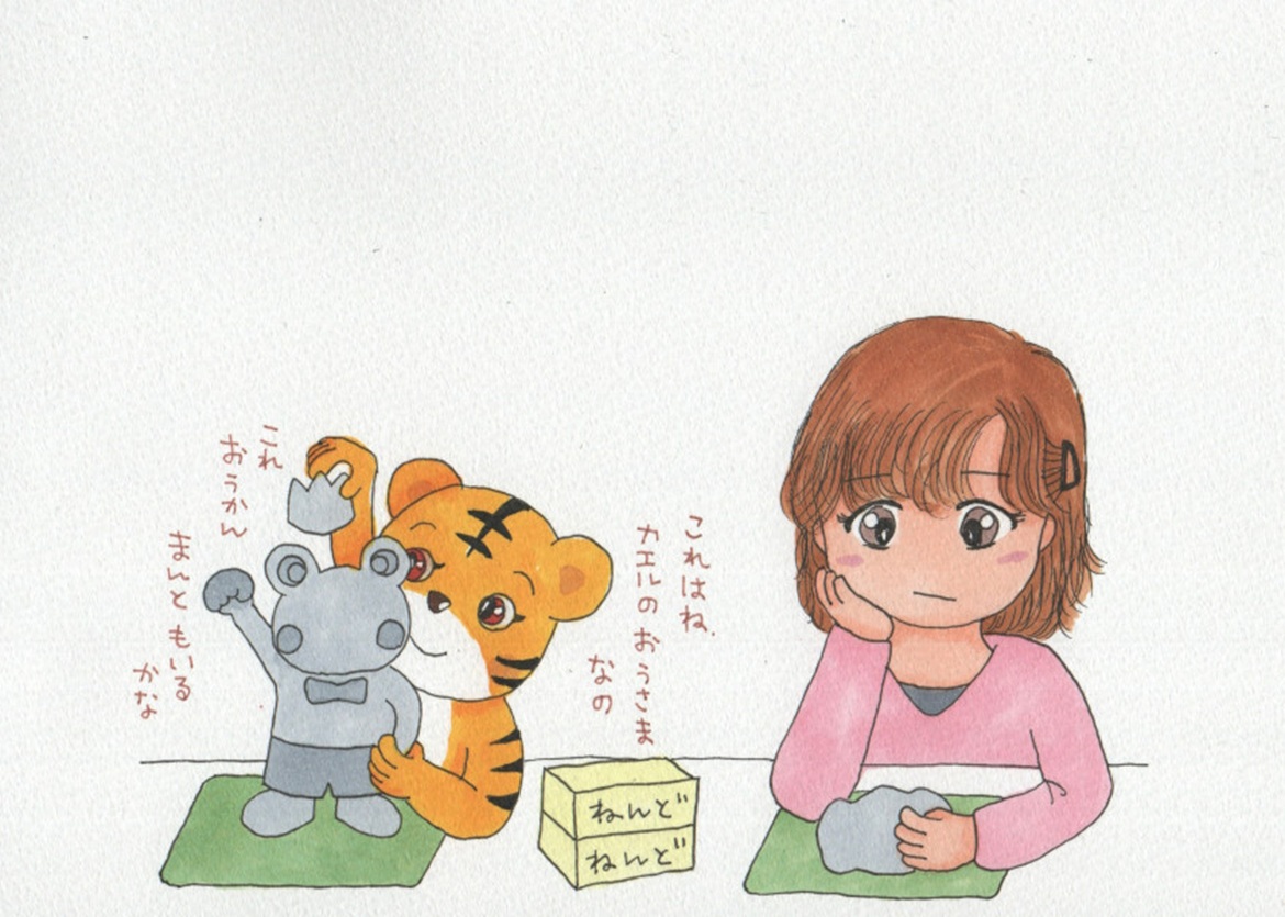 粘土遊びをする女の子とトラの子の、手描きイラスト